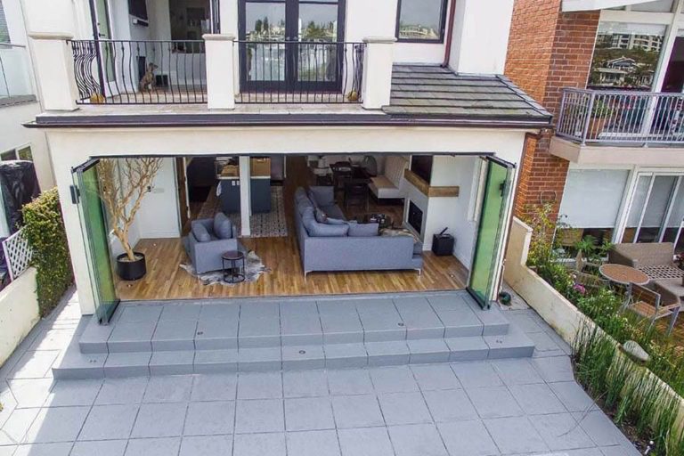 Overview from above featuring the property with stacked frameless sliding glass doors.