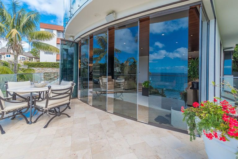 Looking from the patio into home through frameless glass.