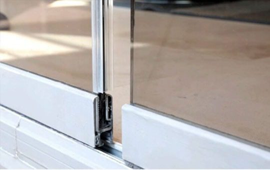 Closeup of frameless glass interlocking channels
