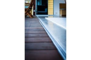 Frameless sliding glass door track.