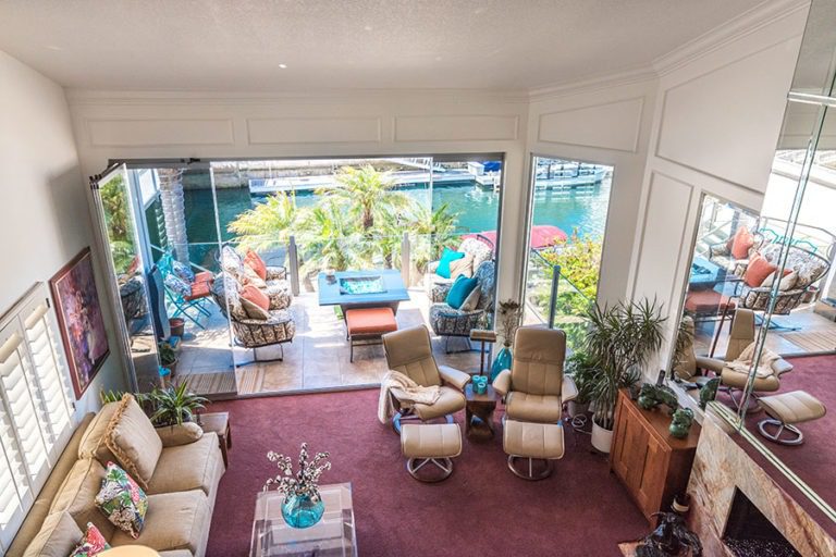 Living space from above featuring open sliding glass doors with patio views.