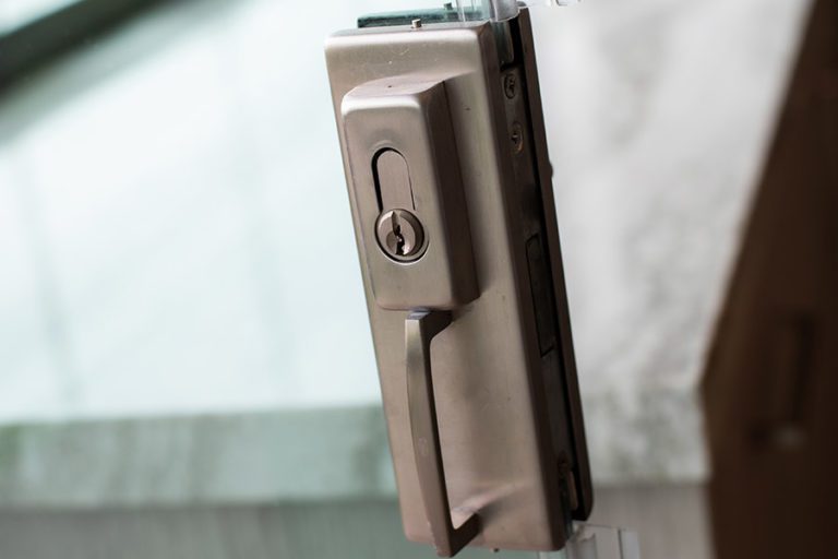 Lock handle to the frameless glass doors to the open concept living and kitchen room.