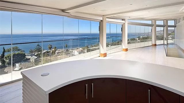 ocean view with frameless glass doors